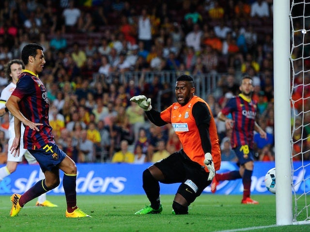 Barca striker Pedro scores against Santos on August 2, 2013