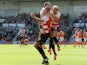 Doncaster's Rob Jones is congratulated by team mates after scoring a penalty to equalise against Blackpool on August 3, 2013