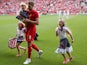 Steven Gerrard of Liverpool walks his three daughters of the pitch prior to the Steven Gerrard Testimonial Match on August 3, 2013