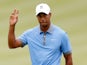 Tiger Woods gestures after holing a putt at Firestone CC on August 2, 2013