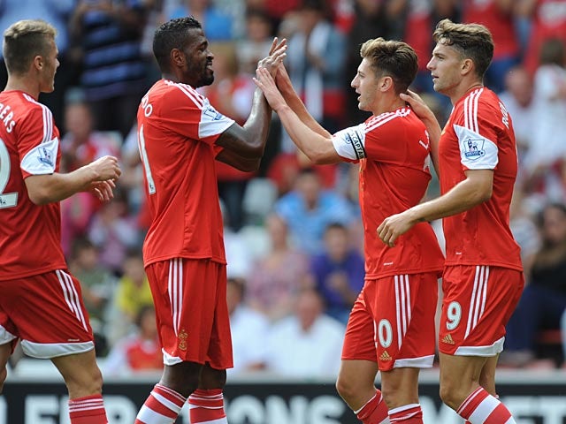 Southampton's Adam Lallana is congratulated by team mates after scoring against Real Sociedad during a friendly match on August 10, 2013