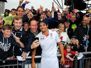 England captain Alastair Cook celebrates with fans after retaining the Ashes on August 5, 2013