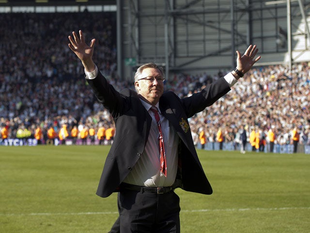 Manchester United's Scottish manager Alex Ferguson acknowledges fans at the end of the English Premier League football match between West Bromwich Albion and Manchester United on May 19, 2013