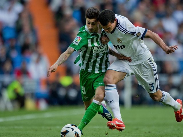 Alvaro Vadillo battles for possession with Real Madrid defender Pepe.