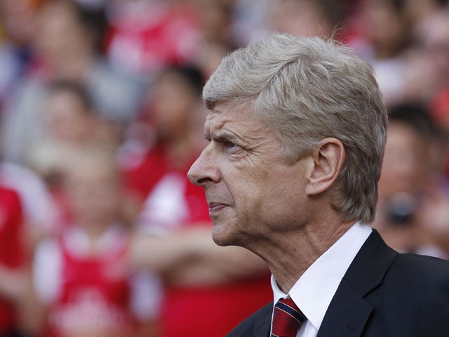 Arsenal's French manager Arsene Wenger looks on ahead of the pre-season friendly football match between Arsenal and Galatasaray on August 4, 2013