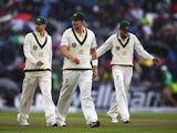 Michael Clarke, Shane Watson and Nathan Lyon of Australia walk off as rain falls during day five of the 3rd Investec Ashes Test match between England and Australia on August 5, 2013