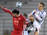 Auxerre's Benoit Pedretti and Ajaccio's Ludovic Asuarl battle for the ball on January 3, 2009