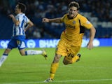 Newport's Conor Washington wheels away after scoring against Brighton on August 6, 2013
