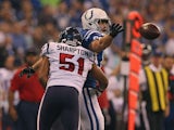 Darryl Sharpton of the Houston Texans tackles Coby Fleener of the Indianapolis Colts on December 30, 2012
