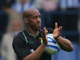 Dion Dublin applauds the travelling Norwich City fans.