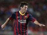 Barcelona's Lionel Messi in action against Thailand XI during a friendly match on August 7, 2013