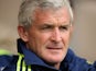 Stoke City manager Mark Hughes watches his new team during the pre season friendly match between Wrexham AFC and Stoke City on August 4, 2013