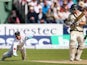 England's Matt Prior dives forward to catch the ball and dismiss Australia's Chris Rogers on day three of the fourth Ashes Test