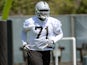 Menelik Watson #71 of the Oakland Raiders participates in drills during Rookie Mini-Camp on May 11, 2013