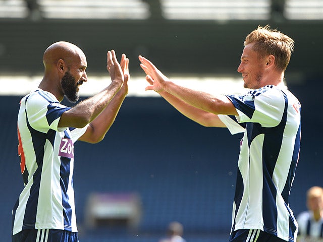 West Brom's Markus Rosenberg is congratulated by team mate Nicholas Anelka after scoring against Bologna during a friendly match on August 10, 2013