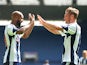 West Brom's Markus Rosenberg is congratulated by team mate Nicholas Anelka after scoring against Bologna during a friendly match on August 10, 2013