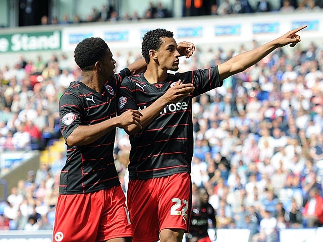 Reading's Nick Blackman is congratulated by team mate Gareth McCleary after scoring the equaliser against Bolton on August 10, 2013