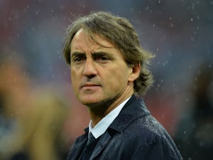 Manchester City's Italian manager Roberto Mancini reacts after his team lost the English FA Cup final football match between Manchester City and Wigan Athletic on May 11, 2013