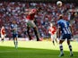 Manchester United striker Robin van Persie heads in the opener against Wigan Athletic in the Community Shield on August 11, 2013