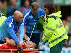 Blackburn Rovers forward Ruben Rochina receives treatment for a dislocated shoulder on August 4, 2013