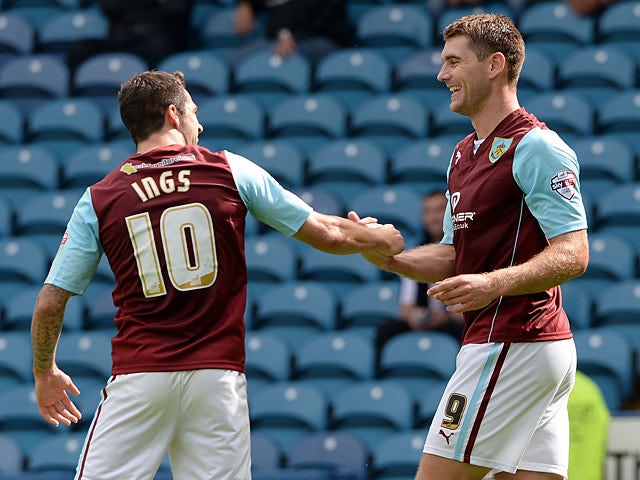 Burnley's Sam Vokes is congratulated by team mate Danny Ings after scoring his team's second goal against Sheffield Wednesday on August 10, 2013
