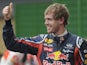 German F1 driver Sebastian Vettel gives the thumb up as celebration of his pole position at the Interlagos racetrack in Sao Paulo on November 26, 2011