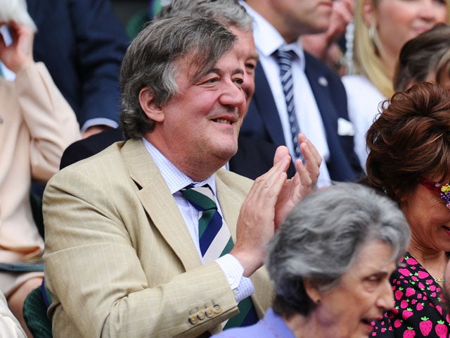 Stephen Fry attend the Ladies' Singles second round match between Eugenie Bouchard of Canada and Ana Ivanovic of Serbia on day three of the Wimbledon Lawn Tennis Championships on June 26, 2013