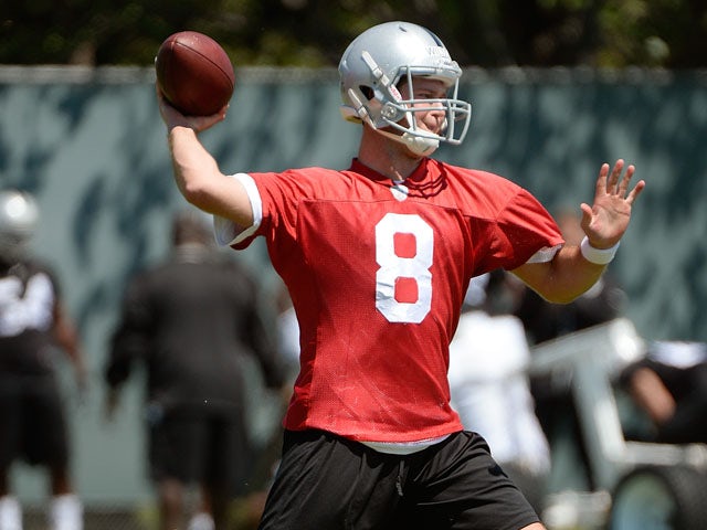 Tyler Wilson of the Oakland Raiders participates in drills during Rookie Mini-Camp on May 11, 2013