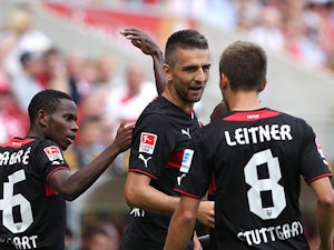 Stuttgart's Vedad Ibisevic is congratulated by team mates after scoring the equaliser against Mainz on August 11, 2013