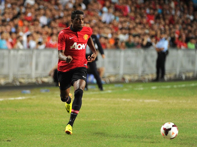 Manchester United's Wilfried Zaha controls the ball against Kitchee during their football friendly match at Hong Kong stadium on July 29, 2013