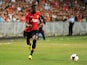 Manchester United's Wilfried Zaha controls the ball against Kitchee during their football friendly match at Hong Kong stadium on July 29, 2013