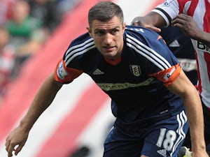 Fulham's Aaron Hughes in action against Sunderland on August 17, 2013