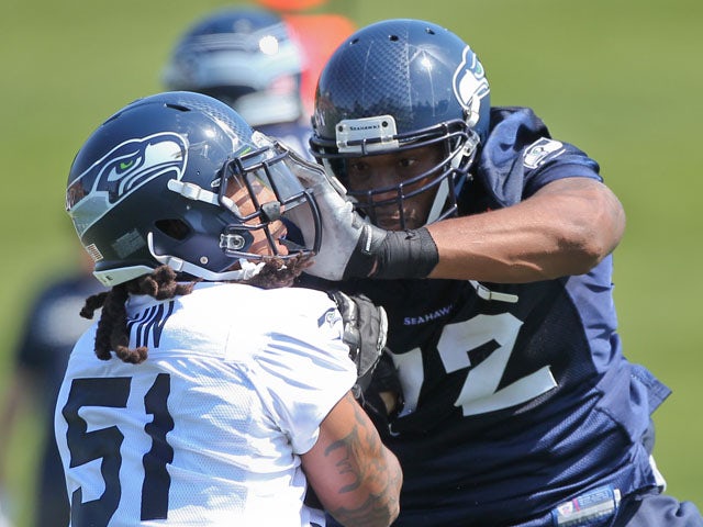Alex Barron of the Seattle Seahawks battles for the ball during minicamp at the Virginia Mason Athletic Center on May 11, 2012