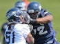 Alex Barron of the Seattle Seahawks battles for the ball during minicamp at the Virginia Mason Athletic Center on May 11, 2012