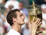 Andy Murray of Great Britain poses with the Gentlemen's Singles Trophy following his victory in the Gentlemen's Singles Final match against Novak Djokovic of Serbia on day thirteen of the Wimbledon Lawn Tennis Championships at the All England Lawn Tennis 