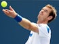 Andy Murray of Grerat Britain serves to Julien Benneteau of France during the Western & Southern Open on August 15, 2013