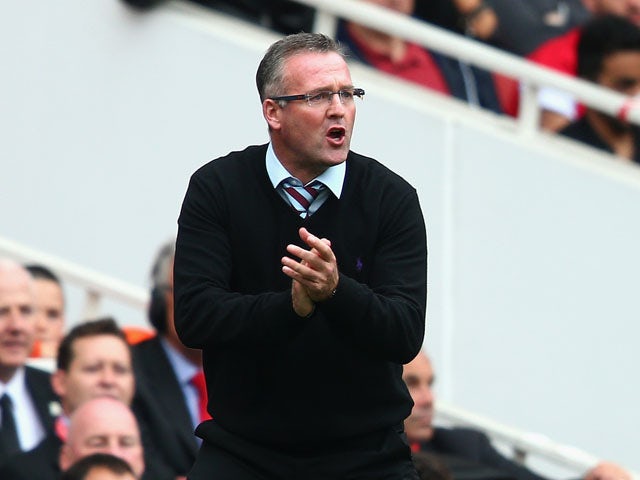 Aston Villa manager Paul Lambert shouts orders to his team during the Barclays Premier League match between Arsenal and Aston Villa at Emirates Stadium on August 17, 2013