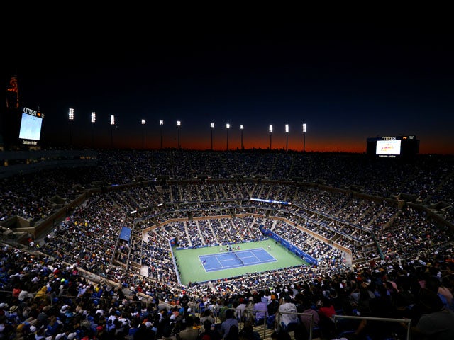 The sun sets as spectators inside Arthur Ashe Stadium watch the men's singles final match between Andy Murray of Great Britain and Novak Djokovic of Serbia on Day Fifteen of the 2012 US Open at USTA Billie Jean King National Tennis Center on September 10,