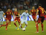 France's midfielder Mathieu Valbuena tries to get past Belgium's defense during the International Friendly on August 14, 2013