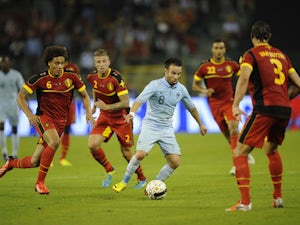 France's midfielder Mathieu Valbuena tries to get past Belgium's defense during the International Friendly on August 14, 2013