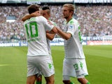 Moenchengladbach's striker Max Kruse and his teammates celebrate scoring during the German first division Bundesliga football match Borussia Moenchengladbach vs Hanover 96 in the German city of Moenchengladbach on August 17, 2013.