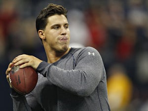 Brian Cushing of the Houston Texans throws a football during warm ups before the Houston Texans played the Indianapolis Colts at Reliant Stadium on December 16, 2012