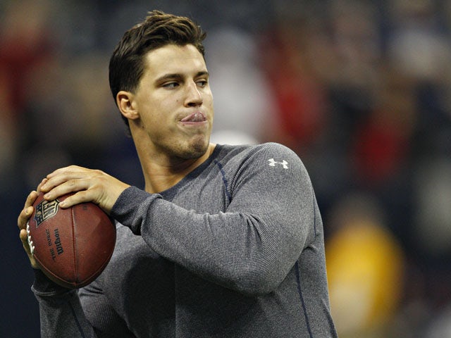 Brian Cushing of the Houston Texans throws a football during warm ups before the Houston Texans played the Indianapolis Colts at Reliant Stadium on December 16, 2012