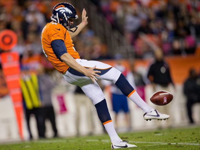 Punter Britton Colquitt of the Denver Broncos punts the ball against the New Orleans Saints at Sports Authority Field Field at Mile High on October 28, 2012