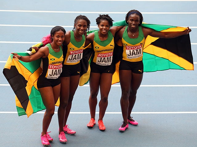 Jamaica pose after winning gold in the Women's 4x100 metres final at the World Championships in Moscow on August 18, 2013