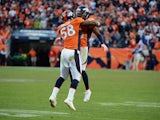 Champ Bailey #24 and Von Miller #58 of the Denver Broncos celebrate after scoring a touchdown on an intercepting during the game against the Tampa Bay Buccaneers at Sports Authority Field at Mile High on December 2, 2012