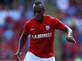 Barnsley's Chris O'Grady in action against Wigan on August 3, 2013