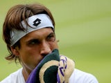 David Ferrer of Spain wipes his face with a towel during the Gentlemen's Singles quarter-final match against Juan Martin Del Potro on July 3, 2013