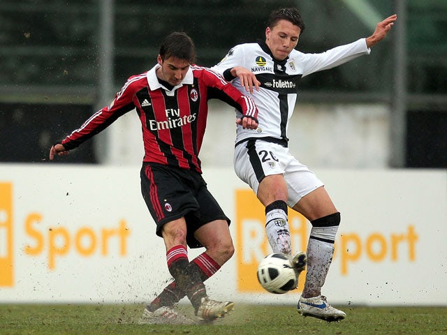 Davide Pacifico of AC Milan for the ball with Andrea Lenzi Pappaianni of Parma FC during the Viareggio Juvenile Cup match between AC Milan and Parma FC at Stadio Torquato Bresciani on February 23, 2013