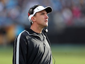 Head coach Dennis Allen of the Oakland Raiders watches on from the sidelines during their game against the Carolina Panthers at Bank of America Stadium on December 23, 2012